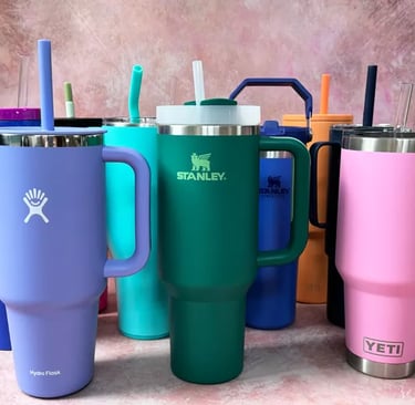 a variety of colorful colored mugs and tumblers