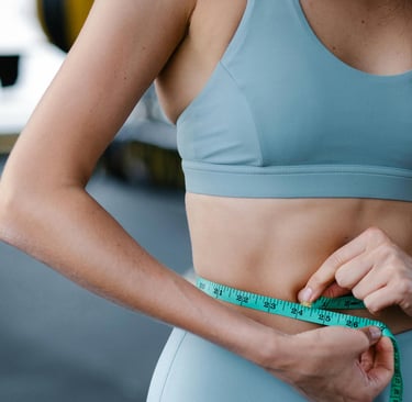 a woman in a blue top and measuring tape measure tape