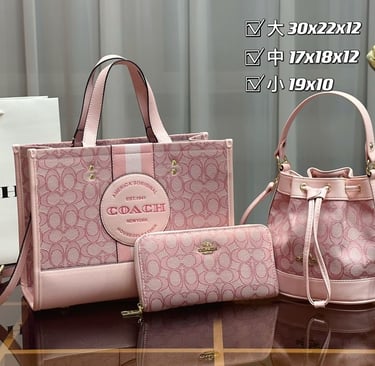 a coach handbag with a pink purse and a white purse