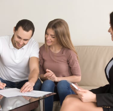 a man and woman sitting on a couch