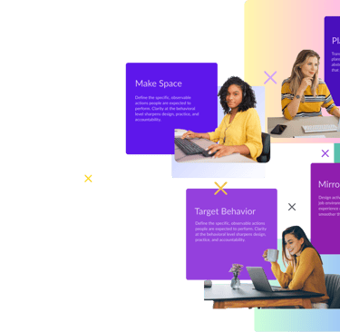 a group of people sitting at a table with laptops