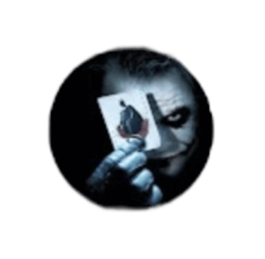 The Joker from The Dark Knight holding a joker playing card in front of his face on a black background.