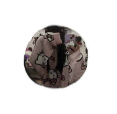 Girl taking a mirror selfie wearing a pink Hello Kitty fleece sweater and holding a matching phone case.