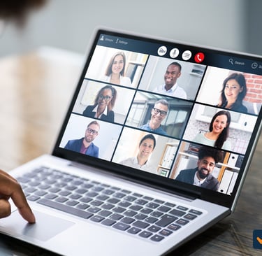 A small business team collaborating remotely through video call, showcasing modern remote-first work