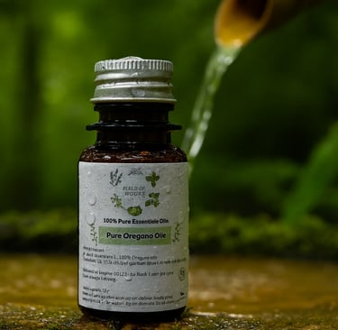 a bottle of oil with a wooden spoon and a wooden spoon