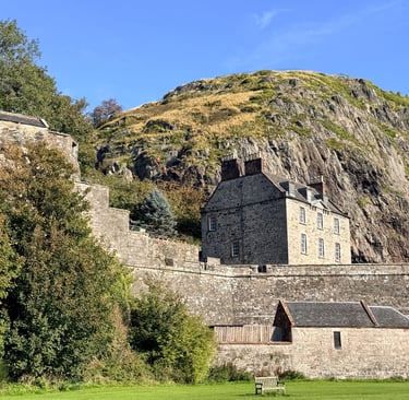 a castle with a mountain in the background