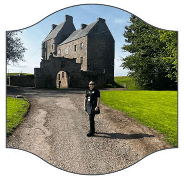 the scottish tour guide standing in front of Midhope Castle.