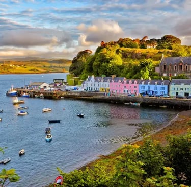 an aerial view of Portree on Skye surrounded by the water