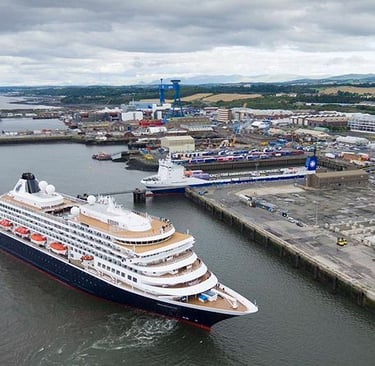 a cruise ship in the water with at Rosyth port