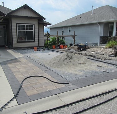 Pavers in place, area now square.