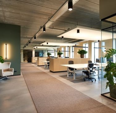 a large open space with a desk and chairs- Residency Clayworks