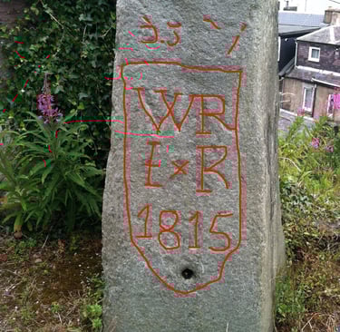 East Face showing graffiti and mystery hole.