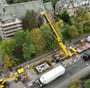 Aerial view of chamber cap being craned into spill chamber.