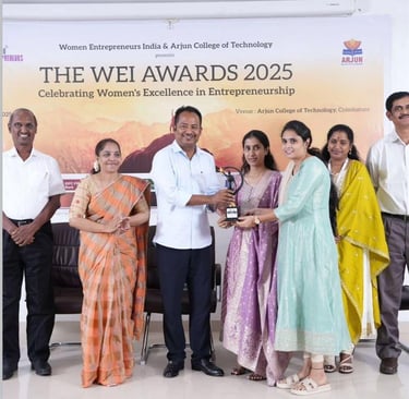 a group of people standing around a table with a man in a white shirt