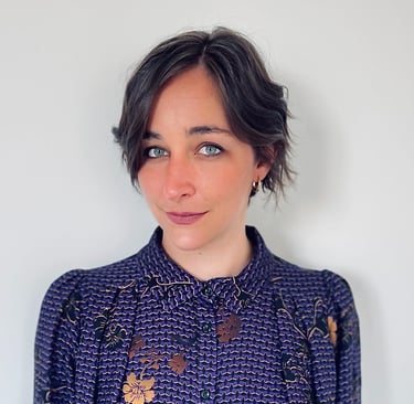 a woman with a purple and gold shirt