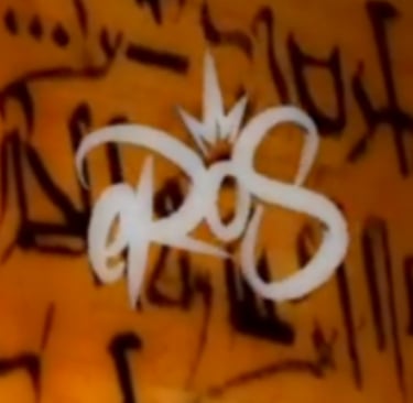 a close up of a sign on a wall eros