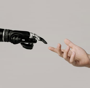 a person's hand reaching out to touch a robot's hand