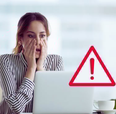 a woman with a laptop computer and a warning sign