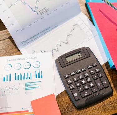 a calculator and a graph on a table