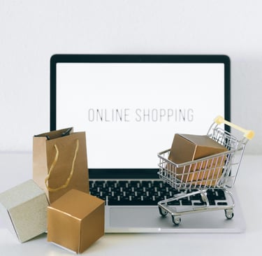 a laptop and shopping cartonce with a shopping carton