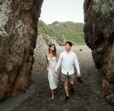 a couple walking through a cave in a cave