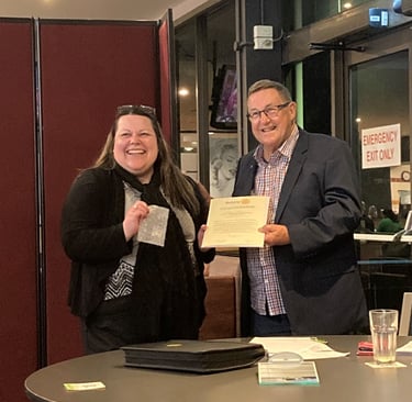 Tracy being congratulated during her induction as a new member of Rotary Club of Queanbeyan