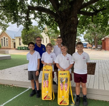Members of QBN Public School accept the Dream Cricket sets on behalf of the school