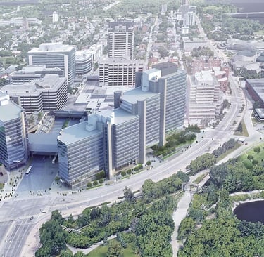 a large multi building office tower set in a city with a river running through it