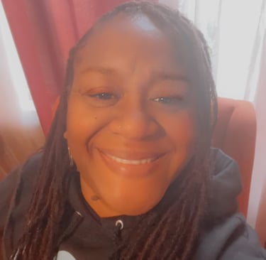 a woman with long hair and a black shirt