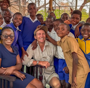 Dave Bennett having fun with school children