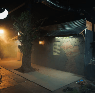 Street-style bar exterior set at Grayfox Studios with realistic façade and sidewalk atmosphere