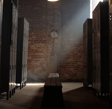 Locker room set at Grayfox Studios with benches, lockers, and sports-inspired atmosphere