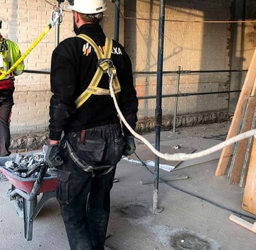 a man in a hard hat and a man in a hard hat