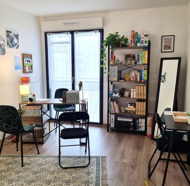 a living room with a table and chairs