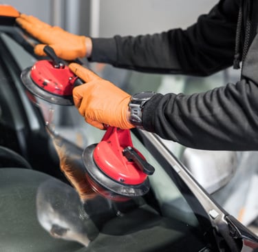 a person wearing gloves and gloves holding a red object