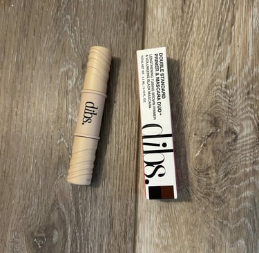 DIBS Mini Mascara & Primer Duo on marble background.