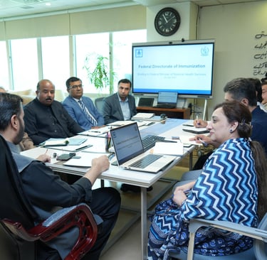 Federal Health Minister Syed Mustafa Kamal chairing Federal Directorate of Immunization meeting