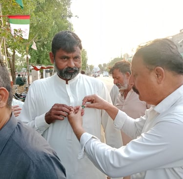 MQM Mirpurkhas leaders hoisting Pakistan’s national flag at UC 2-B Jashn-e-Azadi celebration