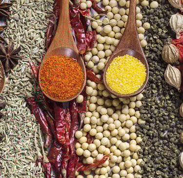 a variety of spices and spices are displayed on a table