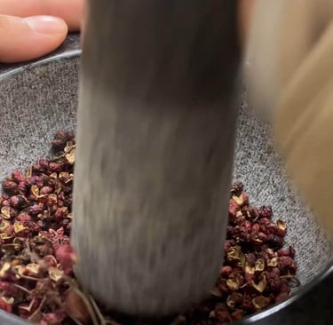 a person is using a grind grinder in a bowl