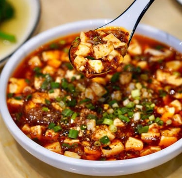 a spoonful of soup with a spoonful of Mapo Tofu