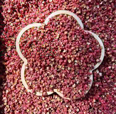 a flowered Sichuan peppercorns with a wooden bowl