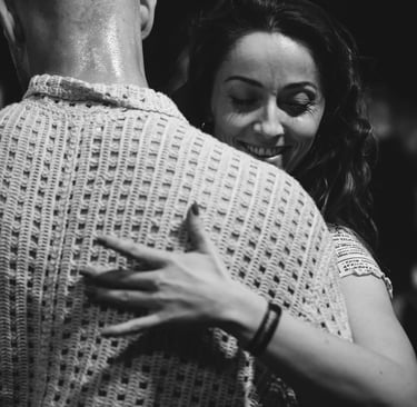 a man and woman dancing at a dance