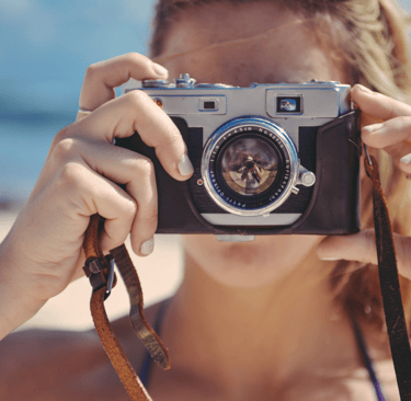 a woman taking a picture of herself taking a picture of herself