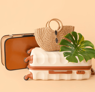 a suitcase with a straw hat and a handbag