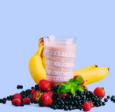 a glass of a fruit smoothie with a measuring tape. two bananas and berries