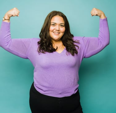 a woman with a purple shirt and black pants