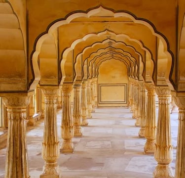 a long hallway with columns and arches
