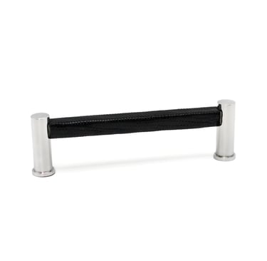 Photography case study featuring a cabinet pull with a leather wrap and silver metal finish.