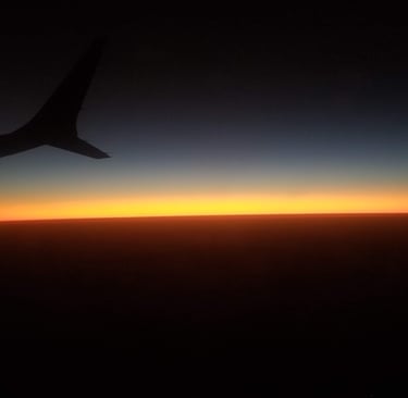 unique view you can only get when flying. Beautiful Sunset from Airplane.